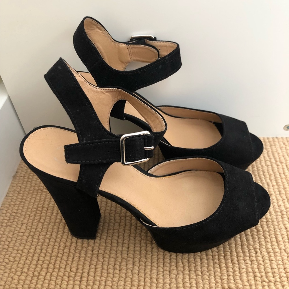 Candie’s black heels with ankle strap.